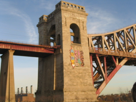 Stone bridge tower against blue sky
